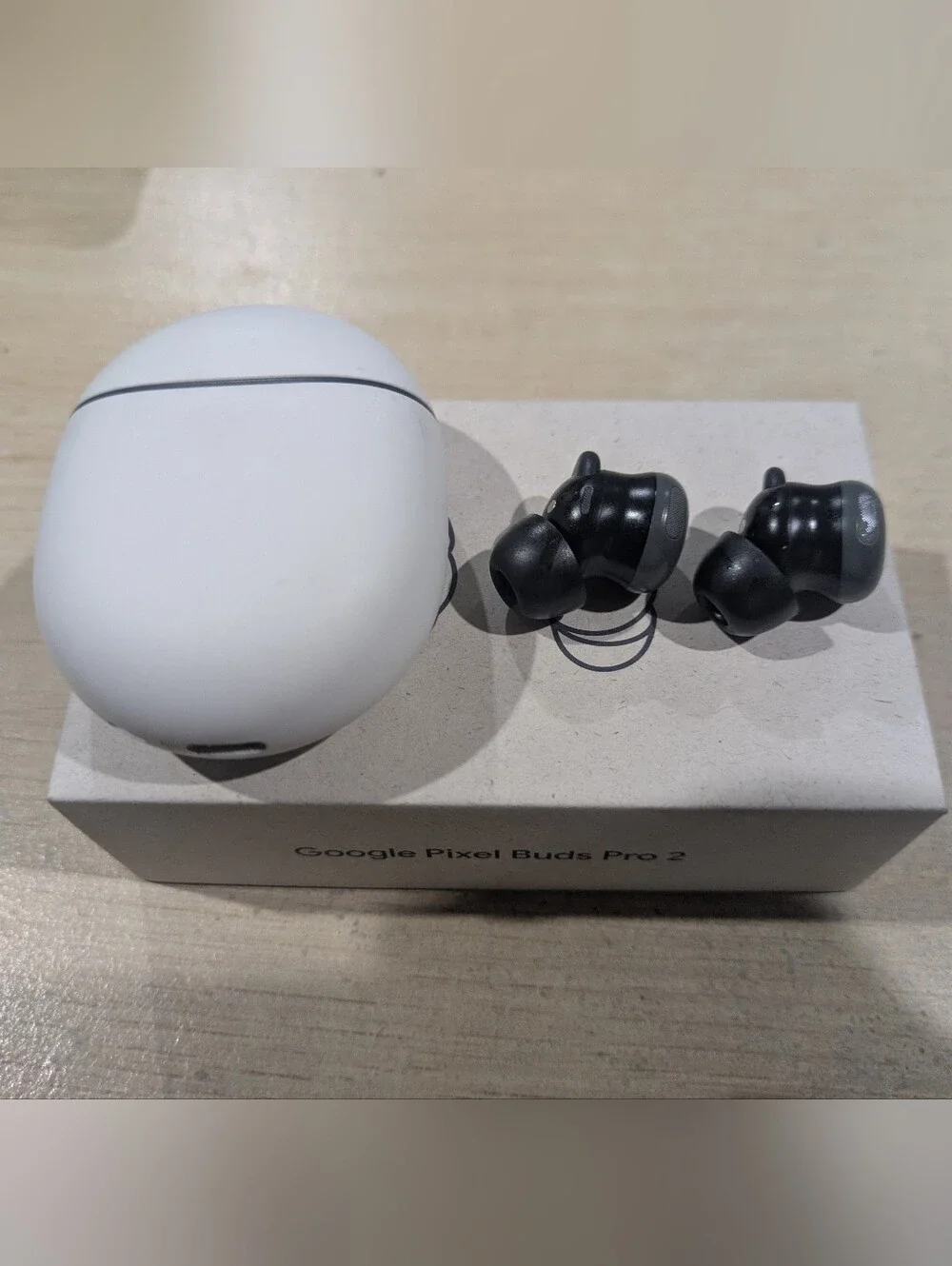 google True Wireless Earbuds with White Charging Case and Gray Earbuds